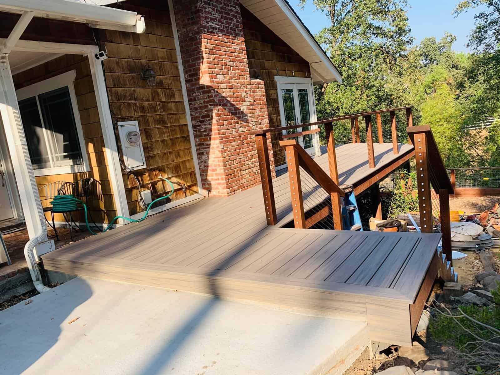 Custom outdoor deck installation by ISMA BUILDERS.